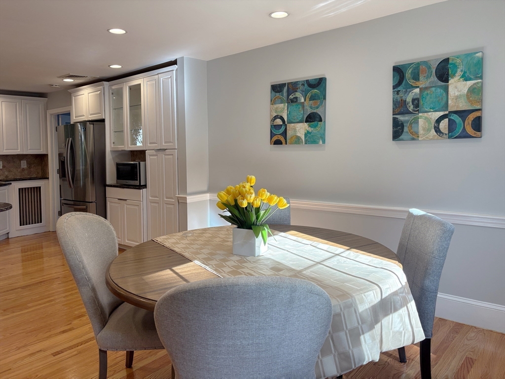 50 Dwhinda Road Newton, MA 02468 - Photo 15 of 42 a bedroom with a bed furniture and a large mirror