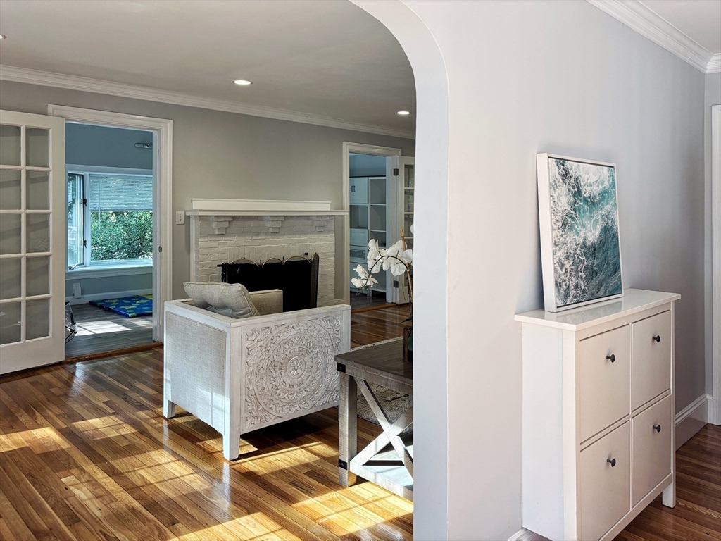 50 Dwhinda Road Newton, MA 02468 - Photo 3 of 42 a living room with furniture and a fireplace