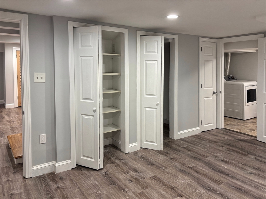 50 Dwhinda Road Newton, MA 02468 - Photo 35 of 42 an empty room with closet and wooden floor