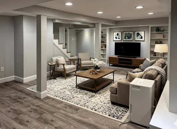 a living room with furniture and a flat screen tv