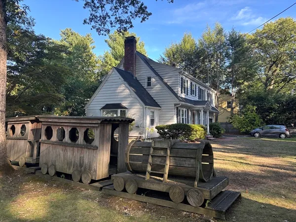 a front view of a house with parking space