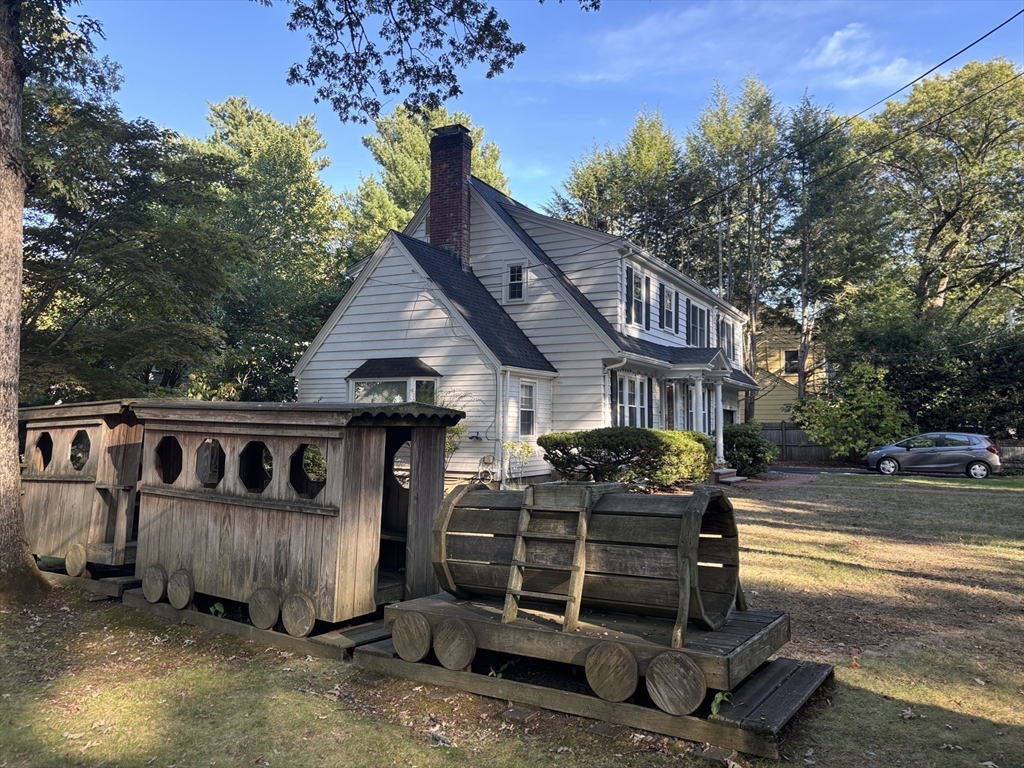 50 Dwhinda Road Newton, MA 02468 - Photo 42 of 42 a front view of a house with parking space