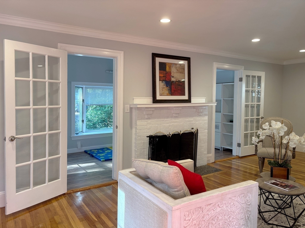 50 Dwhinda Road Newton, MA 02468 - Photo 7 of 42 a living room with furniture and a fireplace