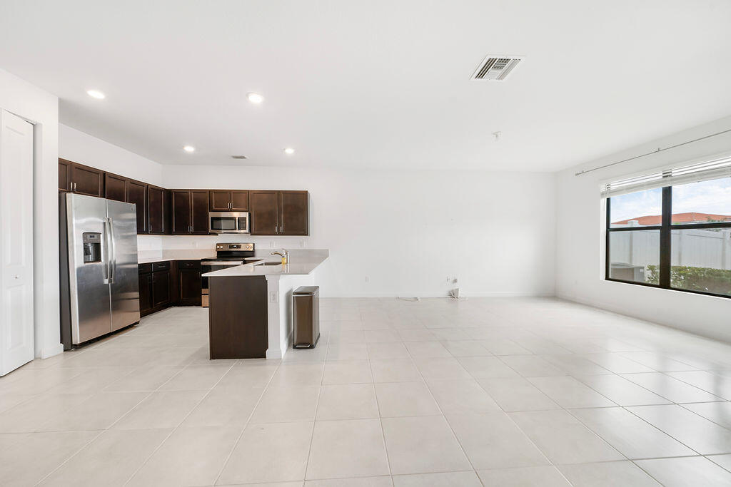 2004 Sugar Maple Drive Riviera Beach, FL 33410 - Photo 28 of 37 Kitchen & Great Room