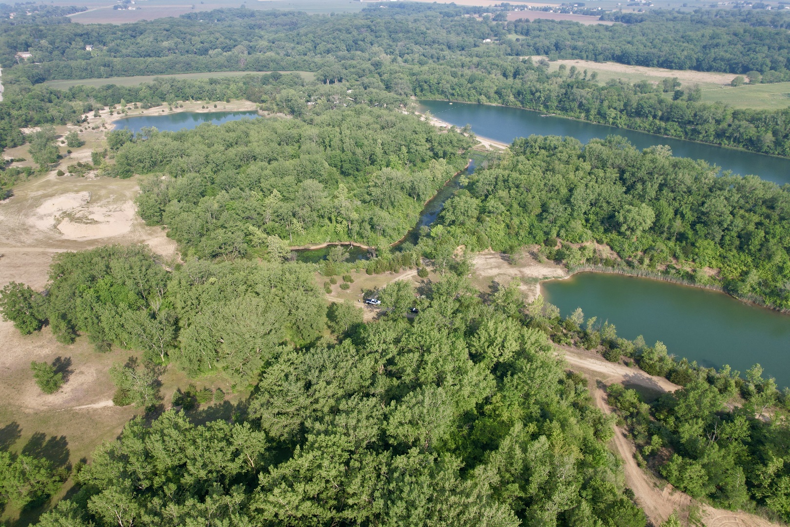 4141 East 2603rd Road Sheridan, IL 60551 - Photo 16 of 48 a view of a lake with a yard and large trees