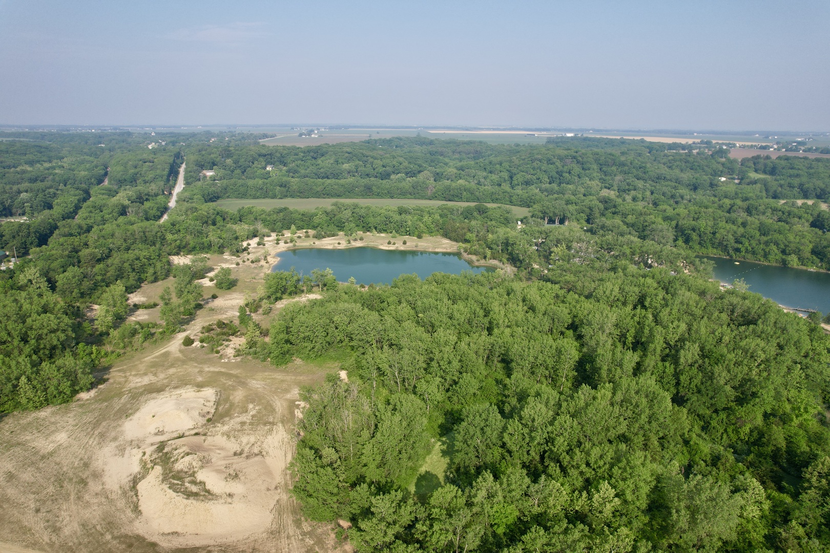 4141 East 2603rd Road Sheridan, IL 60551 - Photo 2 of 48 a view of a city with lush green forest