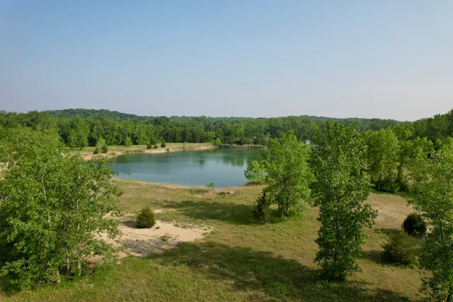 a view of a lake with houses in the back