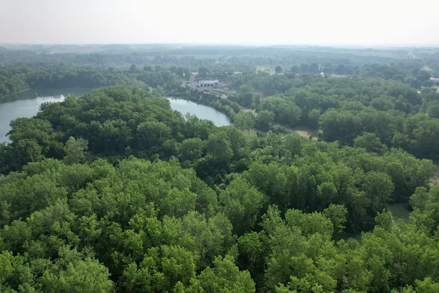 a view of a field with a houses