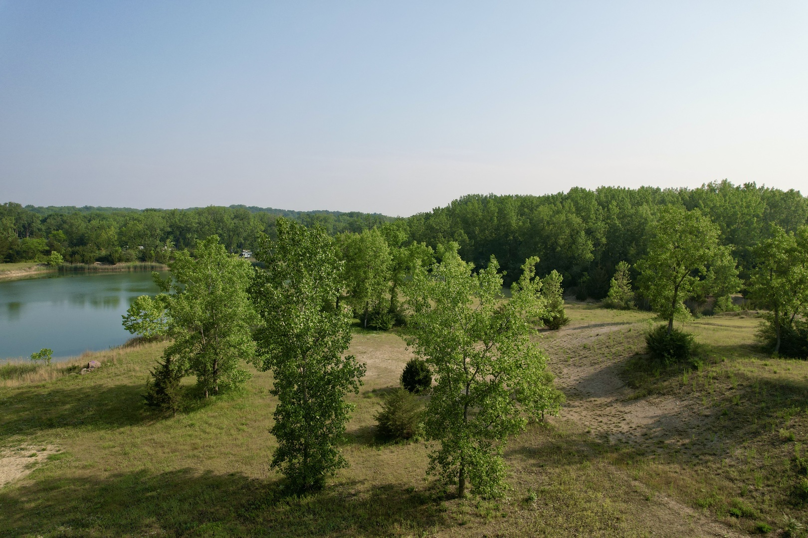 4141 East 2603rd Road Sheridan, IL 60551 - Photo 5 of 48 a view of a garden with a lake
