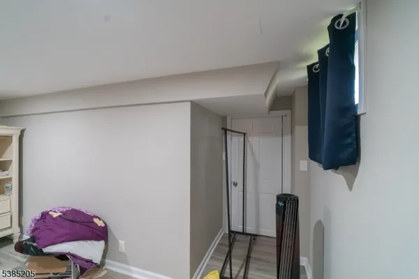 a view of hallway with livingroom and furniture
