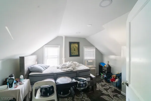 a living room with furniture and flowers