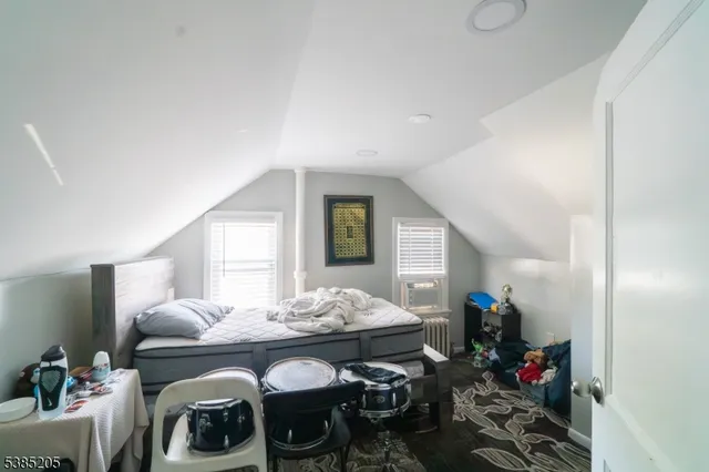 a living room with furniture and flowers