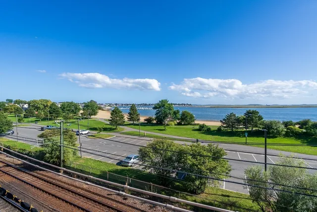 a view of a yard with an ocean view