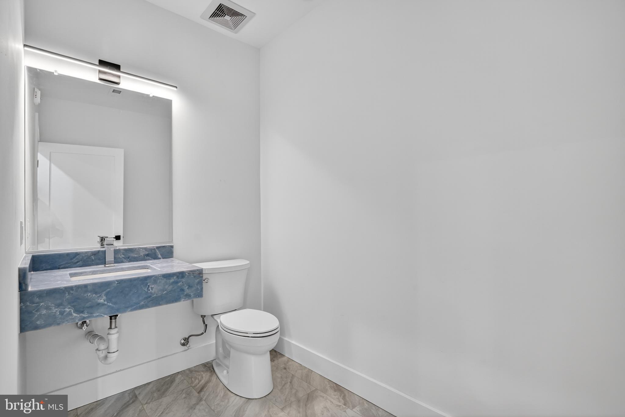 7319 Georgia Avenue Northwest Washington, DC 20012 - Photo 11 of 39 Sleek and modern half-bath retreat.