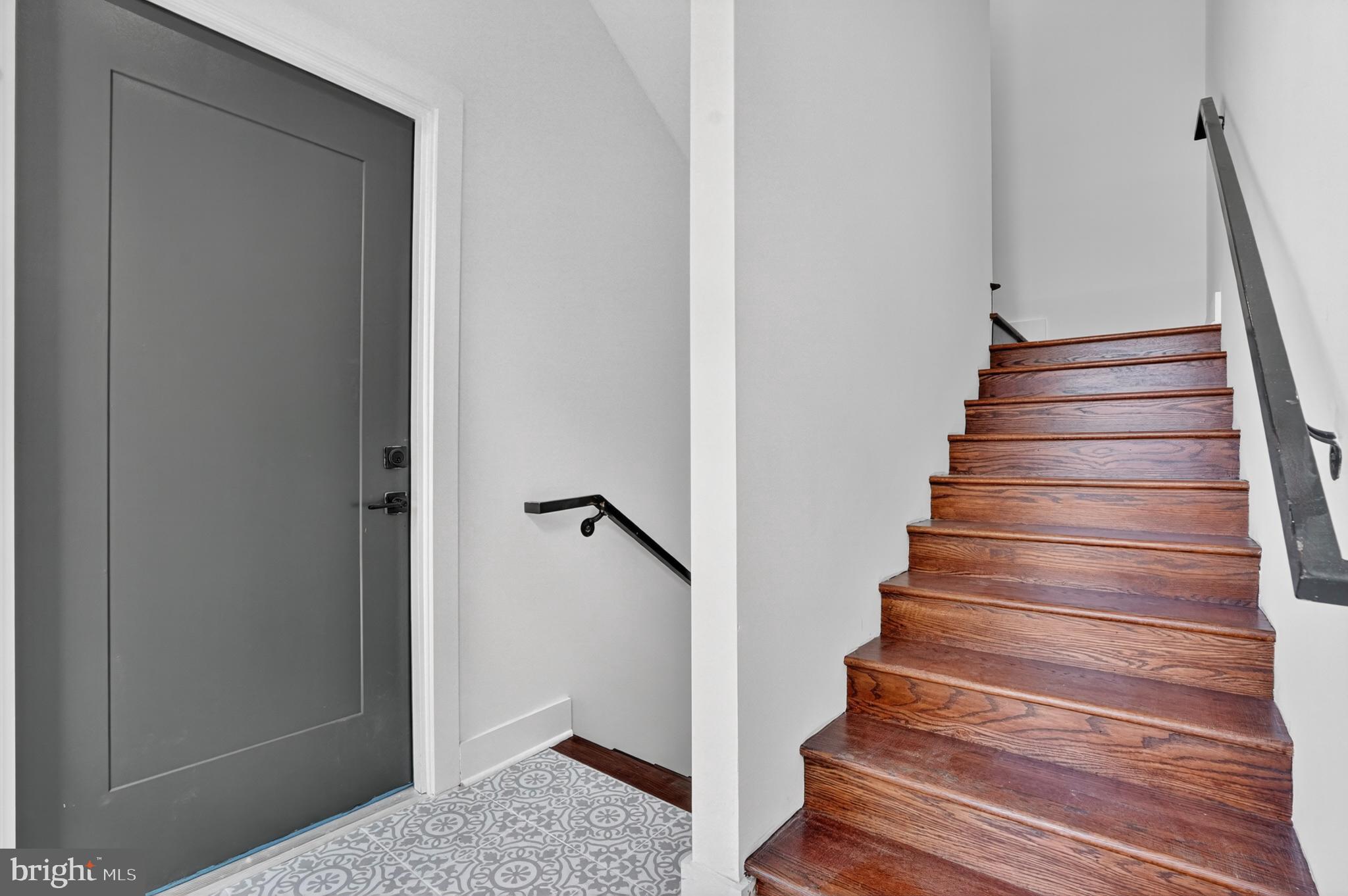 7319 Georgia Avenue Northwest Washington, DC 20012 - Photo 12 of 39 Inviting entryway with elegant staircase.