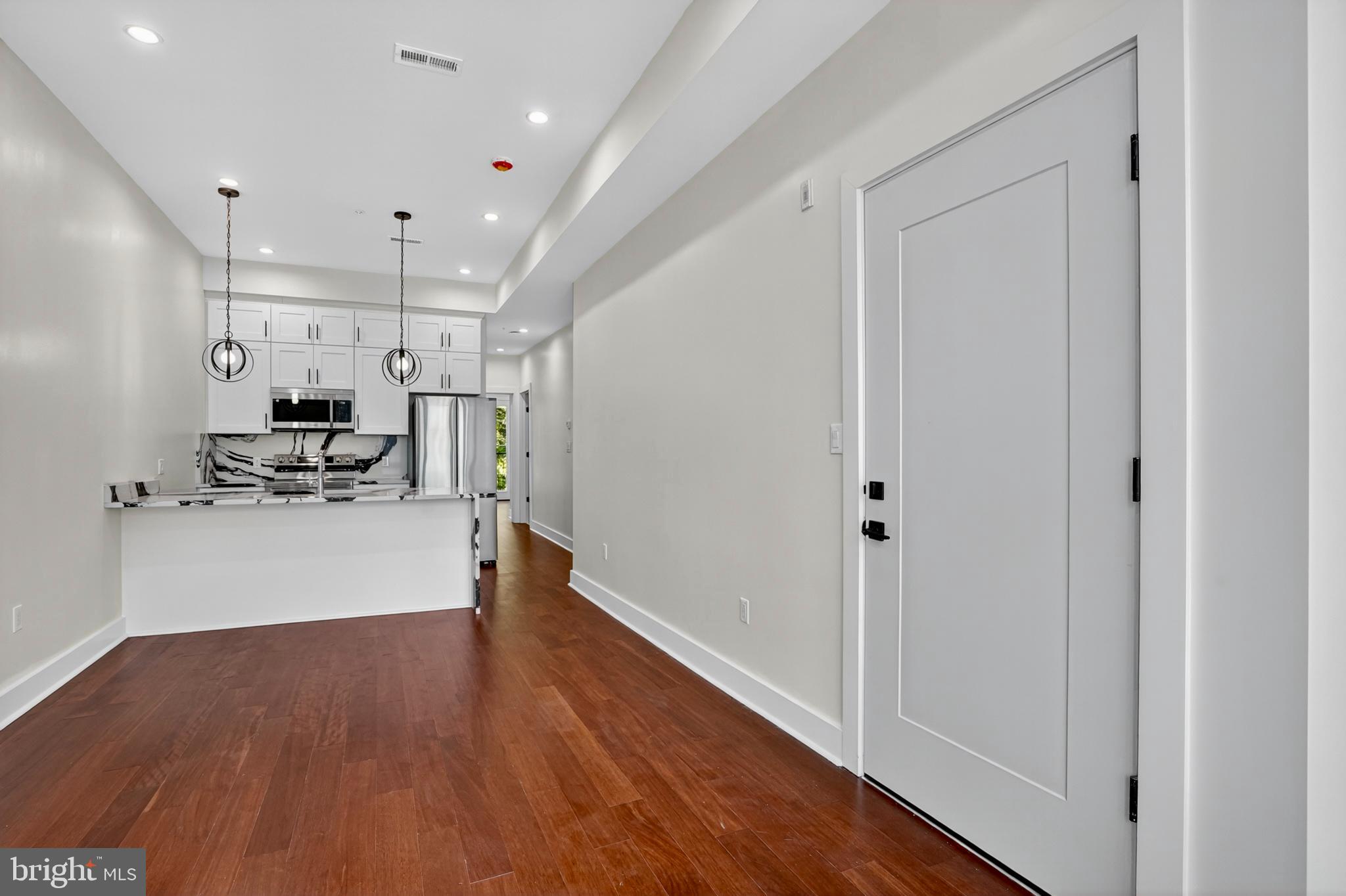 7319 Georgia Avenue Northwest Washington, DC 20012 - Photo 13 of 39 Modern entryway with sleek design elements.