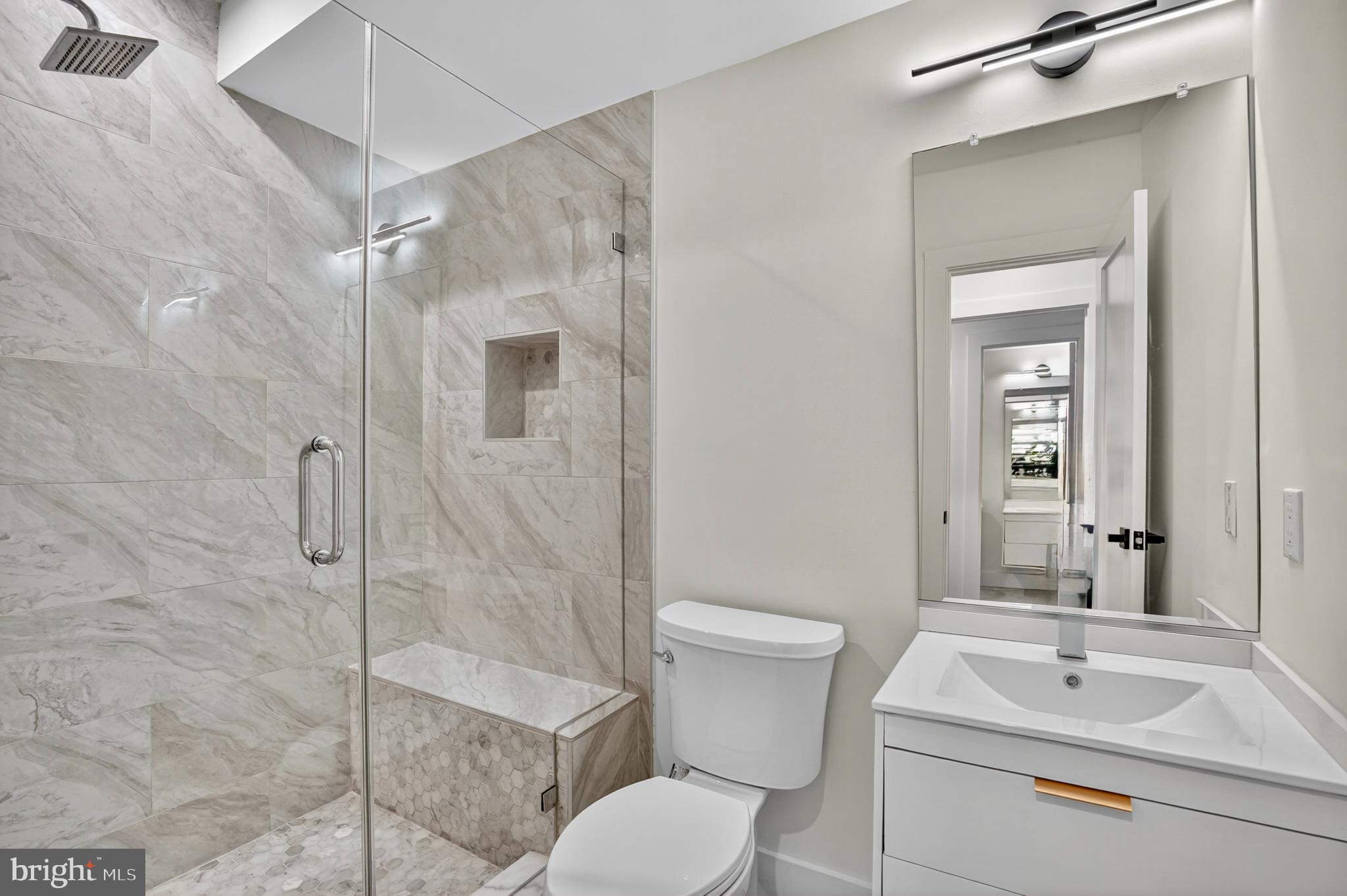7319 Georgia Avenue Northwest Washington, DC 20012 - Photo 16 of 39 Sleek modern bathroom with elegant finishes.