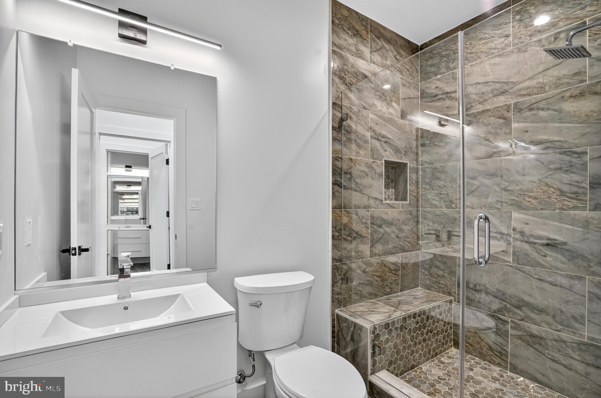 7319 Georgia Avenue Northwest Washington, DC 20012 - Photo 24 of 39 Sleek modern bathroom with elegant finishes.