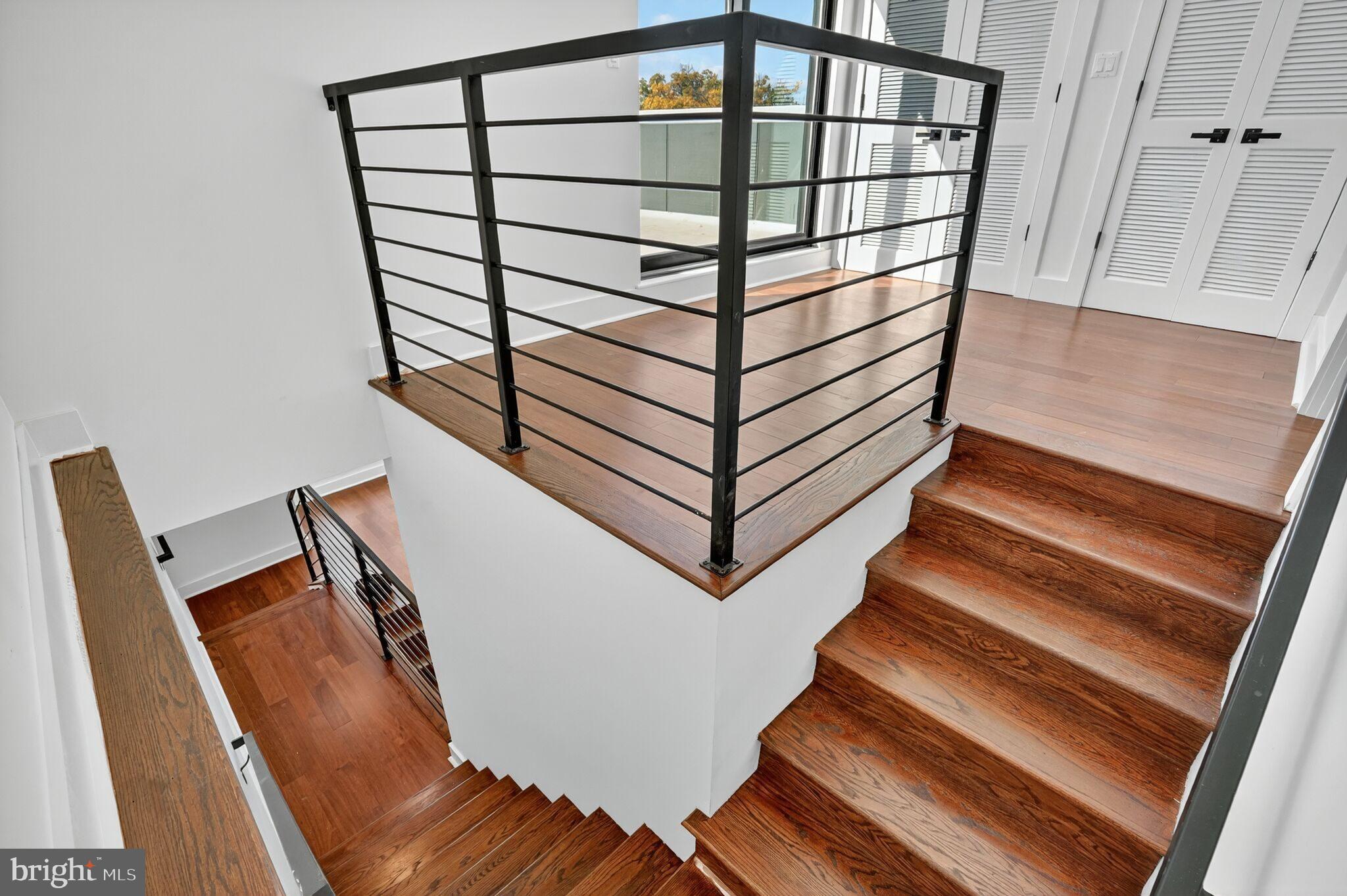 7319 Georgia Avenue Northwest Washington, DC 20012 - Photo 28 of 39 Elegant staircase with modern railings.