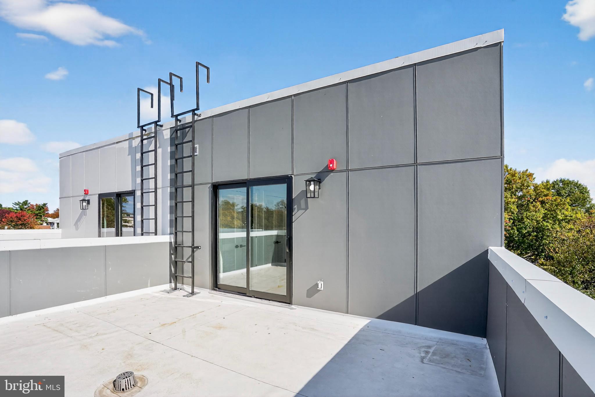 7319 Georgia Avenue Northwest Washington, DC 20012 - Photo 34 of 39 Modern rooftop terrace with scenic views.