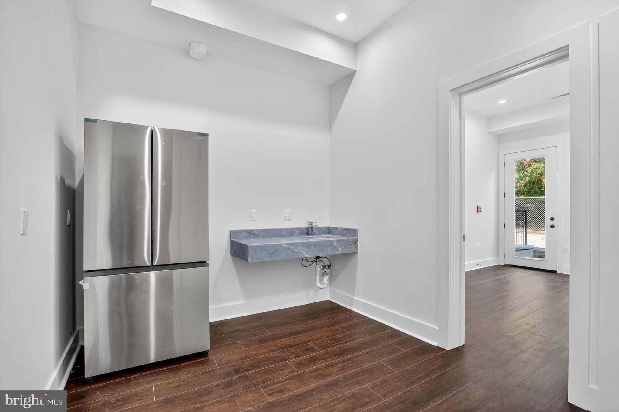 7319 Georgia Avenue Northwest Washington, DC 20012 - Photo 8 of 39 Modern kitchen space with sleek finishes.