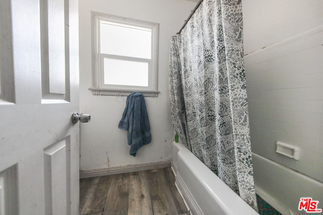 5663 Kester Avenue Van Nuys, CA 91411 - Photo 14 of 15 a view of bathroom with bathtub and shower