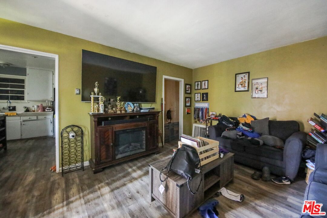 5663 Kester Avenue Van Nuys, CA 91411 - Photo 15 of 15 a living room with furniture and a fireplace