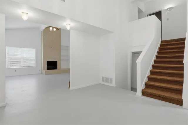 a view of a livingroom with a staircase
