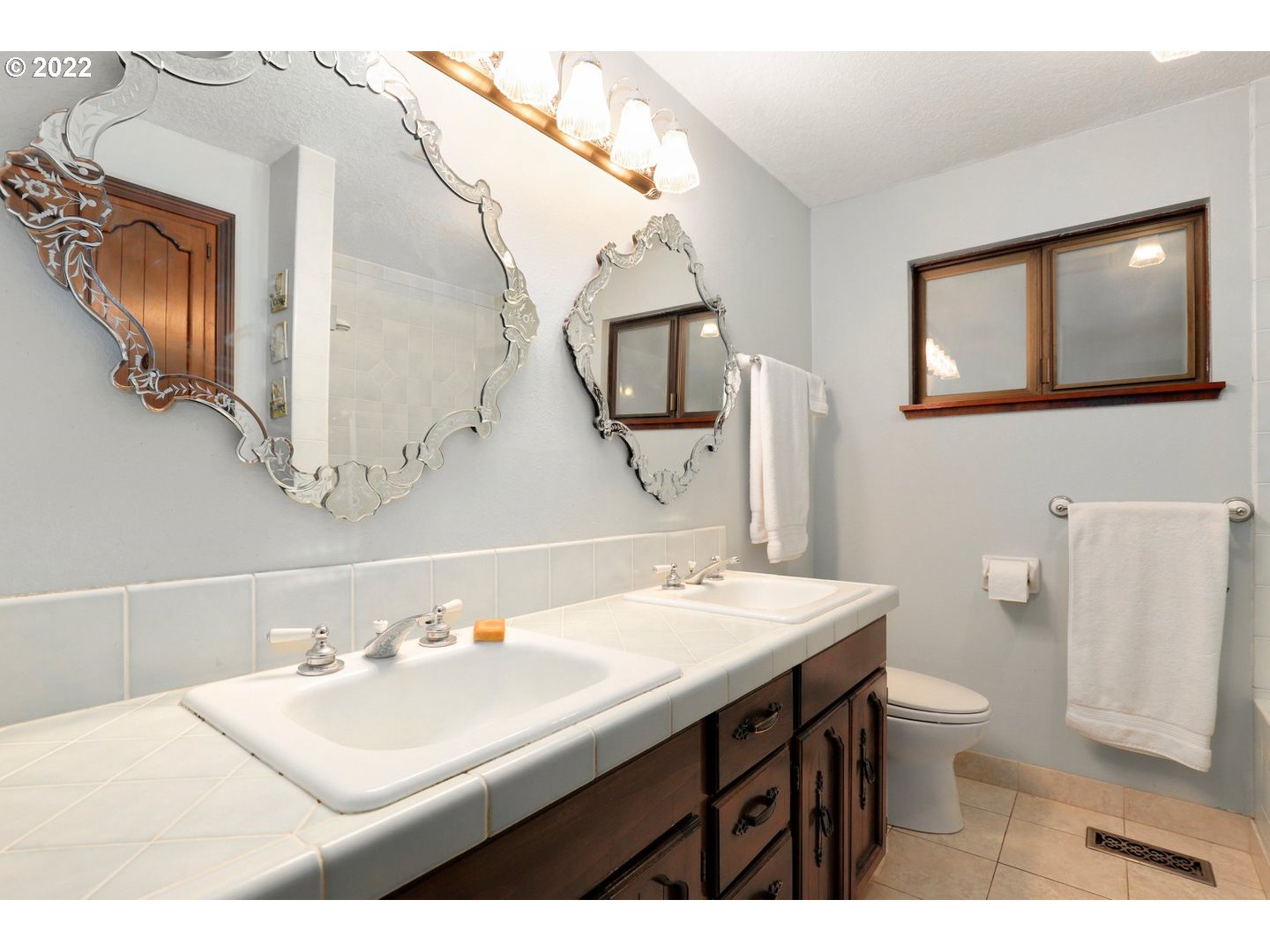 19627 South Ferguson Road Oregon City, OR 97045 - Photo 24 of 32 a bathroom with a sink a toilet and mirror