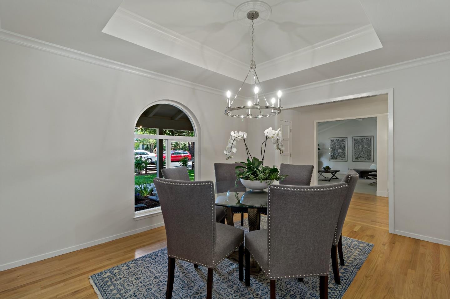 869 Terrace Drive Los Altos, CA 94024 - Photo 15 of 86 a view of a dining room with furniture wooden floor and chandelier