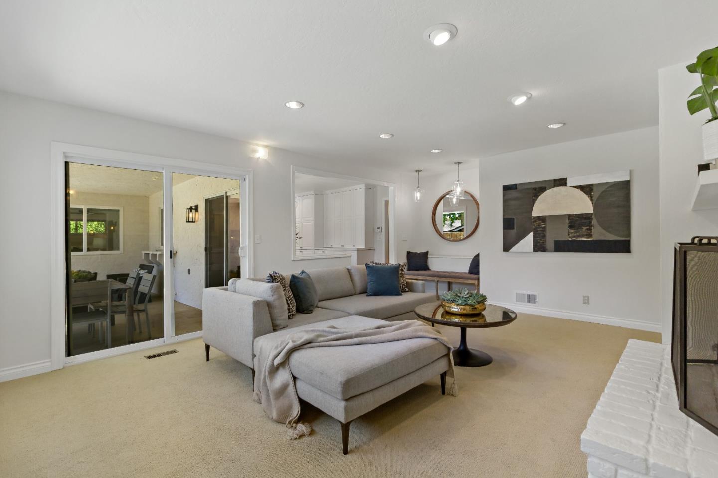869 Terrace Drive Los Altos, CA 94024 - Photo 20 of 86 a living room with furniture and a clock