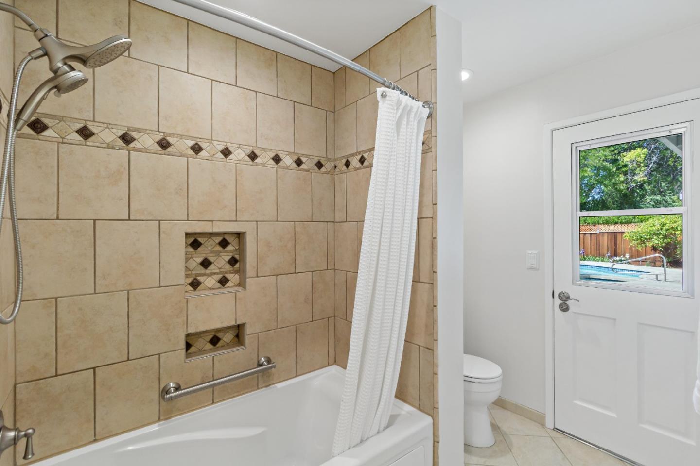 869 Terrace Drive Los Altos, CA 94024 - Photo 41 of 86 a bathroom with a shower and a toilet