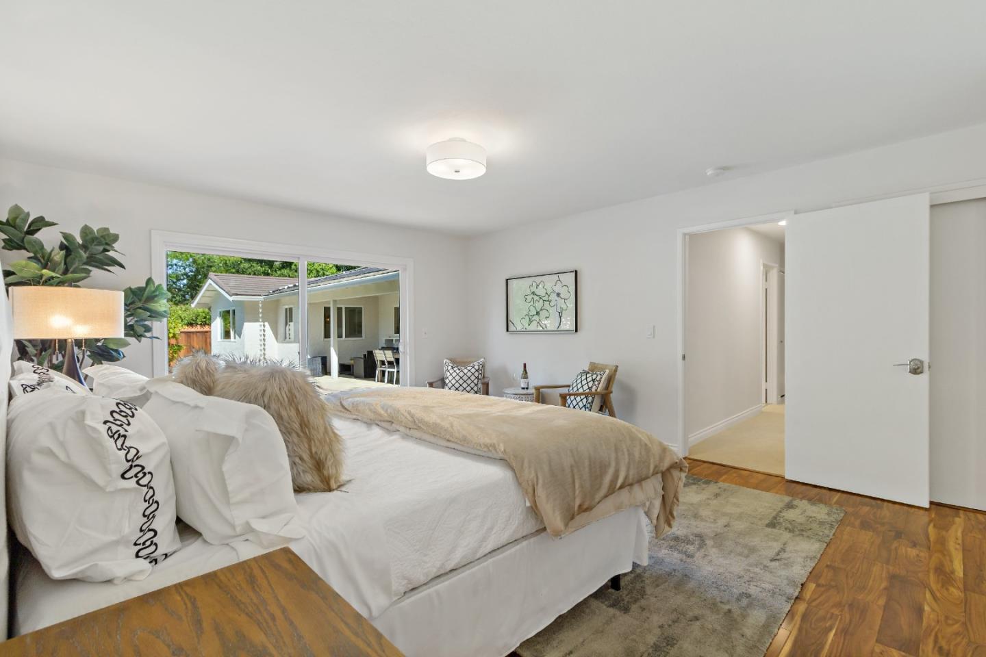869 Terrace Drive Los Altos, CA 94024 - Photo 45 of 86 a bedroom with a large bed and a chandelier