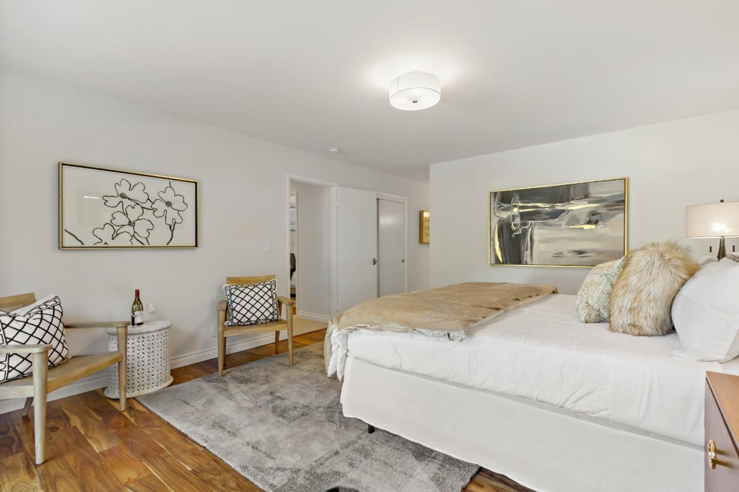 869 Terrace Drive Los Altos, CA 94024 - Photo 46 of 86 a bedroom with a bed a chair and painting on the wall