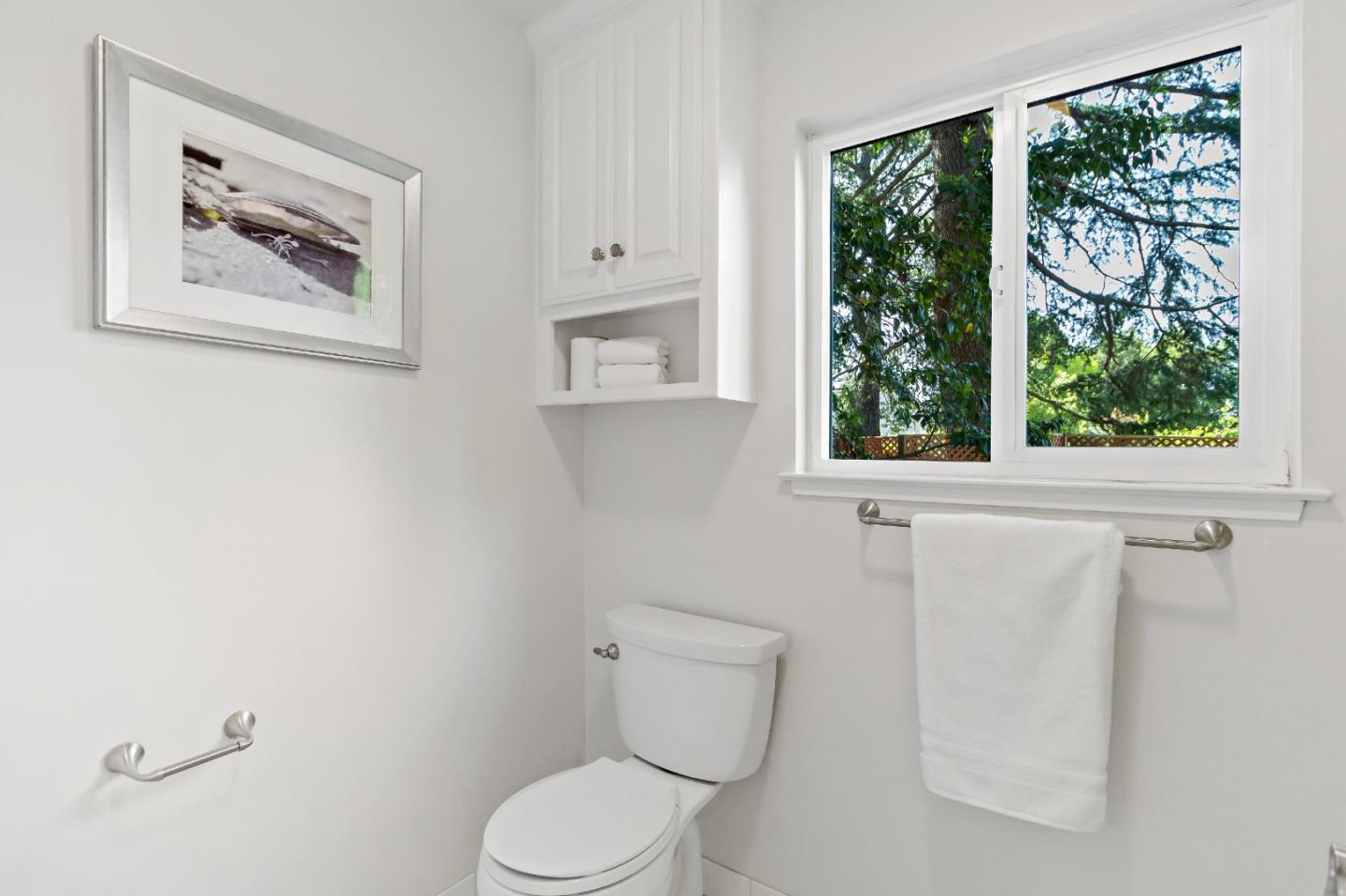 869 Terrace Drive Los Altos, CA 94024 - Photo 49 of 86 a white toilet sitting next to a window in a bathroom
