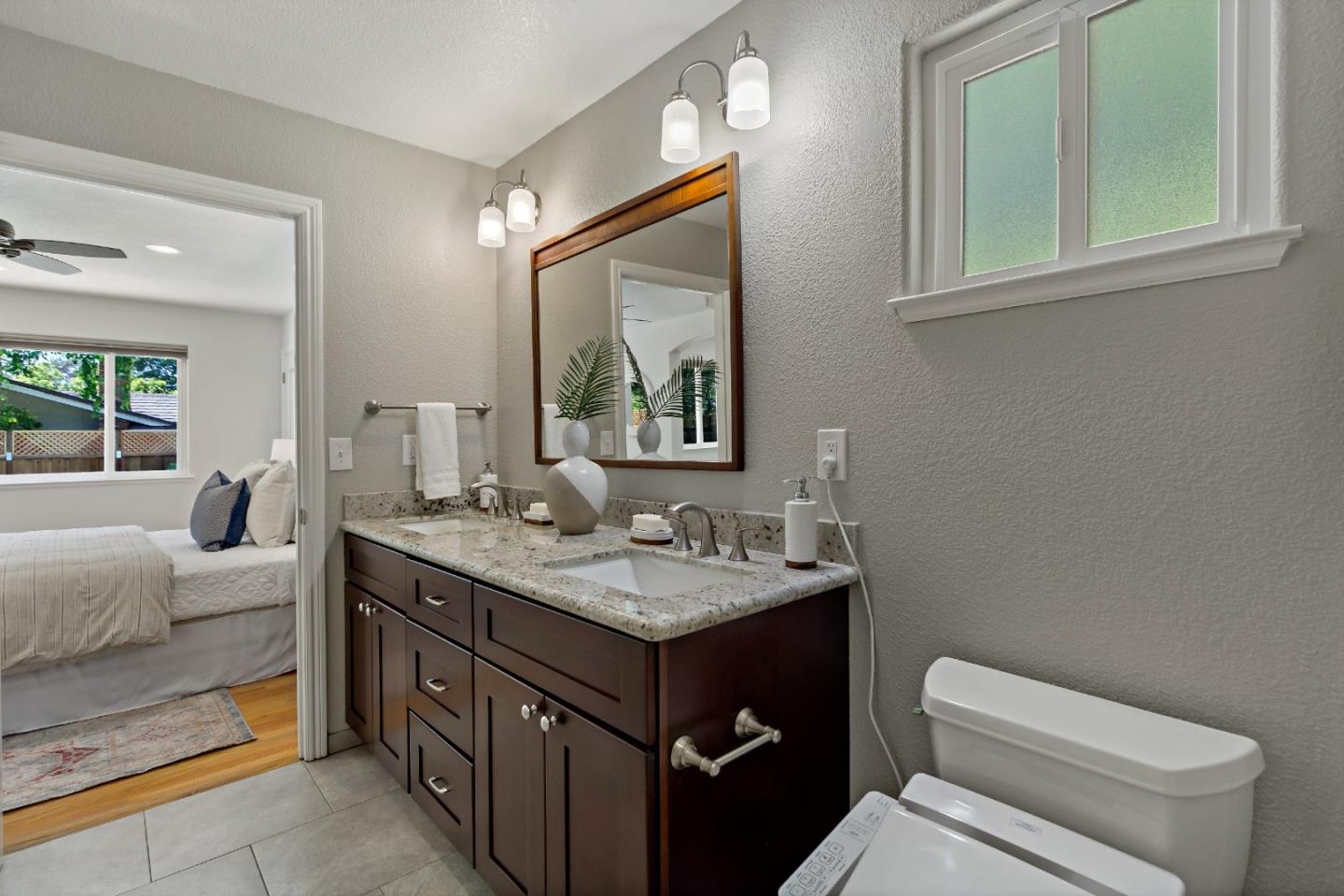 869 Terrace Drive Los Altos, CA 94024 - Photo 59 of 86 a bathroom with a toilet a sink and a mirror
