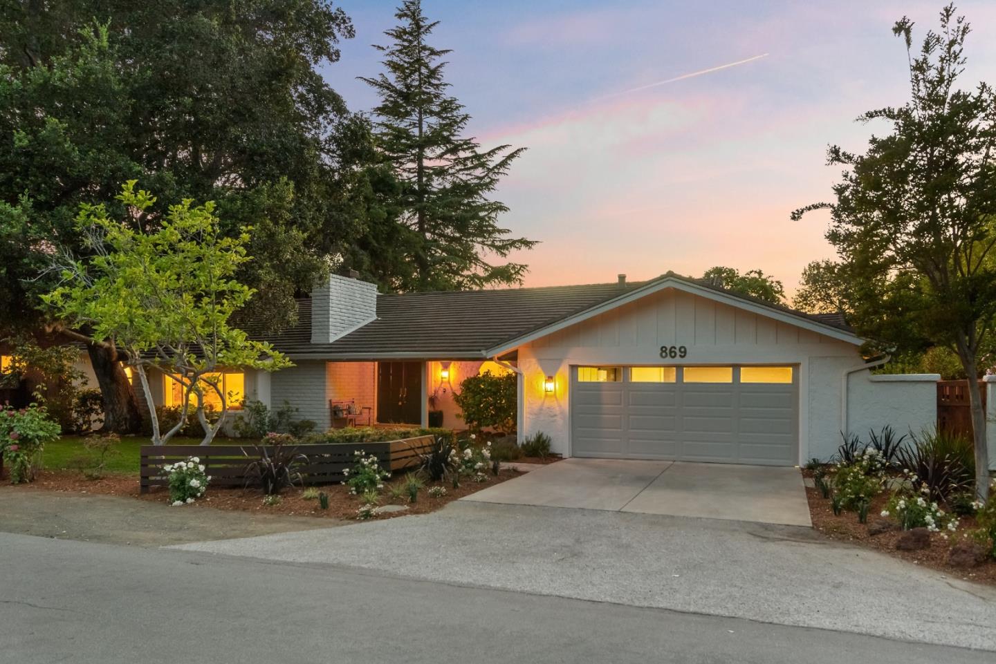 869 Terrace Drive Los Altos, CA 94024 - Photo 6 of 86 a front view of a house with a yard and garage