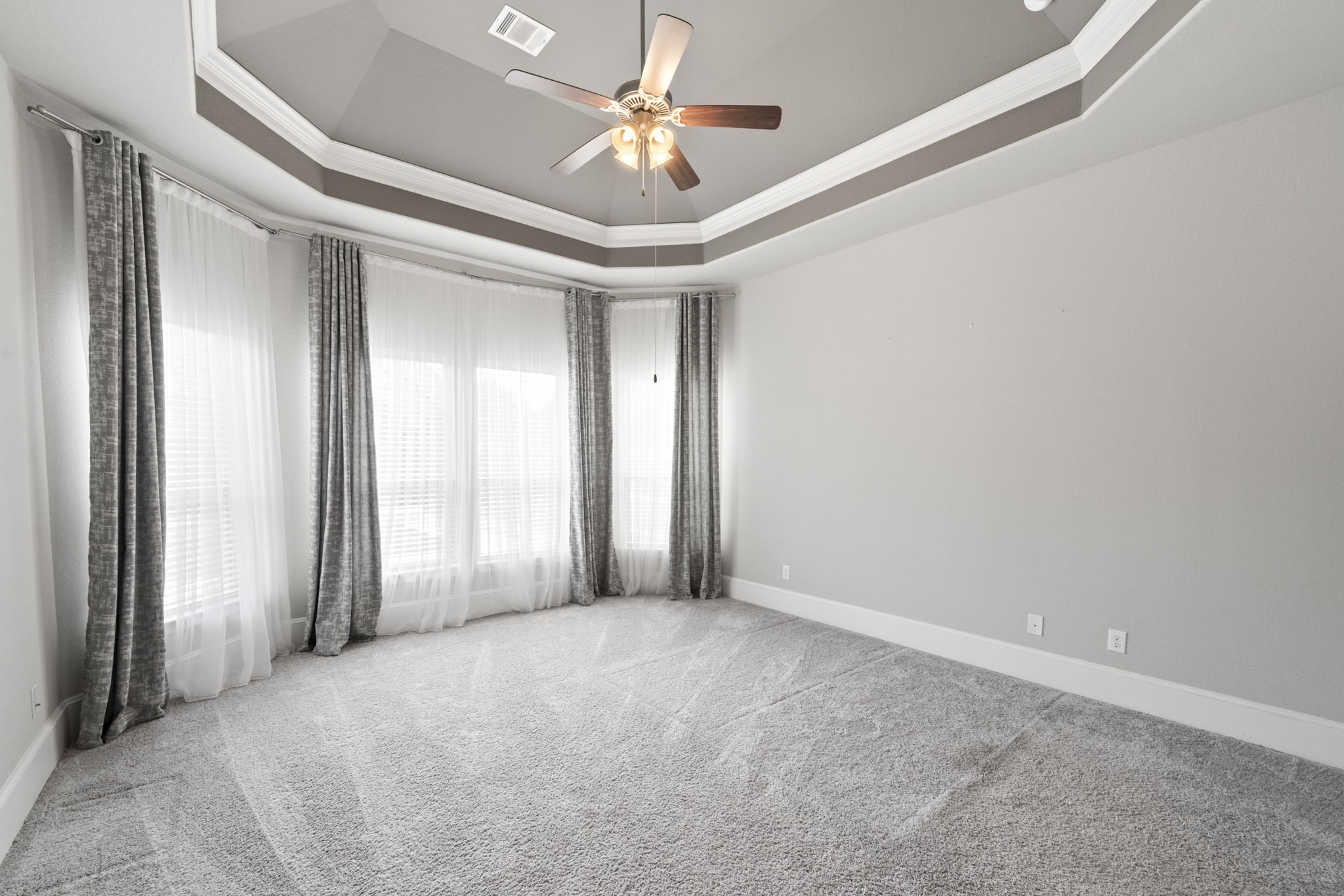 3938 Avalon Ridge Drive Spring, TX 77386 - Photo 19 of 49 A luxurious primary retreat offers a wall of windows, coffered ceiling and plenty of space. You'll feel pampered here