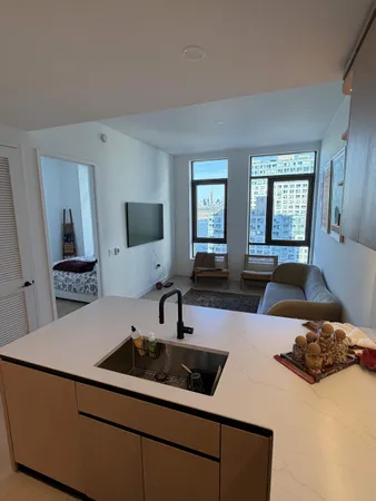 a living room with furniture and a window