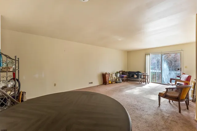 a room with furniture and a large window