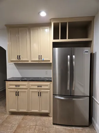 a refrigerator freezer sitting in a kitchen