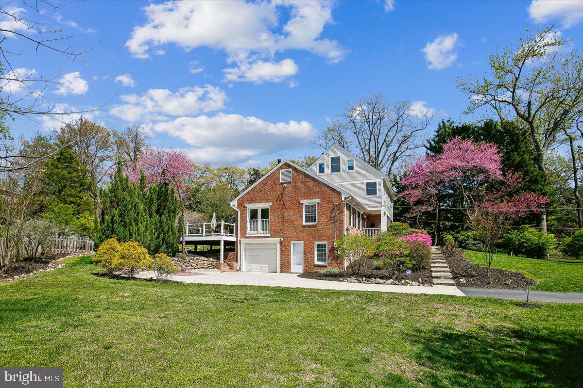 1305 Key Drive Alexandria, VA 22302 - Photo 45 of 64 a front view of a house with a yard and fountain in middle