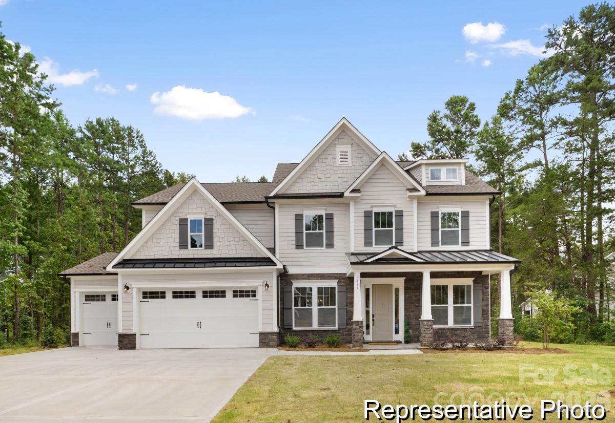 105 West Rice Planters Way, Unit 1P Statesville, NC 28625 - Photo 1 of 41 a front view of a house with a garden