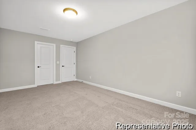 a view of an empty room and a window