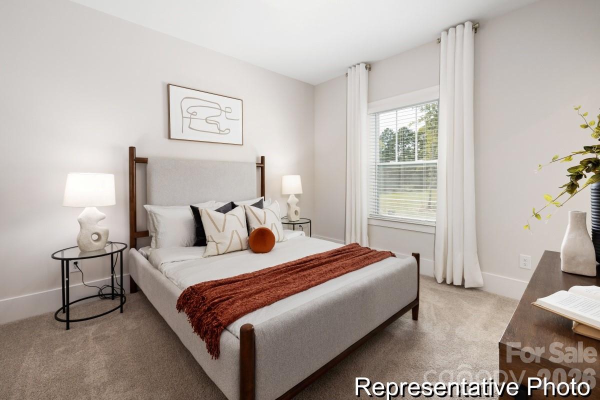 105 West Rice Planters Way, Unit 1P Statesville, NC 28625 - Photo 37 of 41 a bedroom with bed and a window