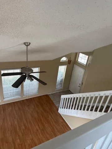 a view of staircase with wooden floor