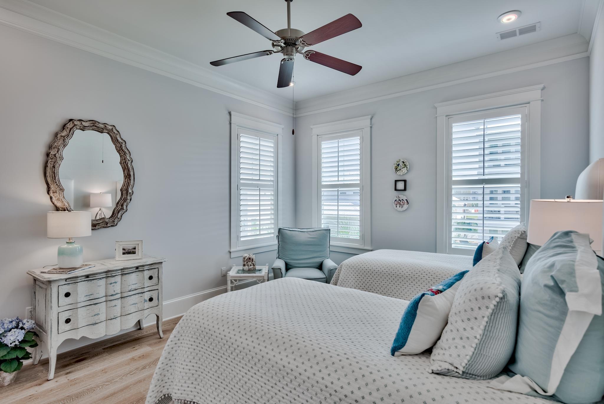 114 Clipper Street Inlet Beach, FL 32461 - Photo 11 of 64 a spacious bedroom with a bed a dresser and a window