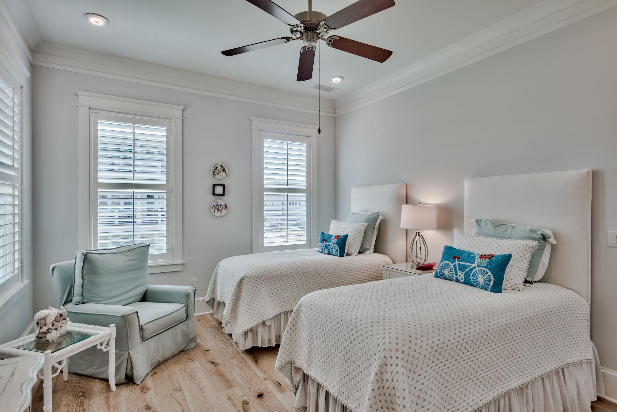 114 Clipper Street Inlet Beach, FL 32461 - Photo 12 of 64 a bedroom with double bed windows and a chandelier