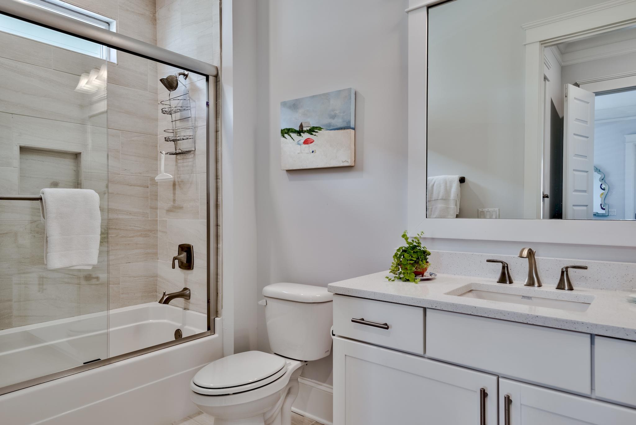 114 Clipper Street Inlet Beach, FL 32461 - Photo 17 of 64 a bathroom with a sink a toilet and a large mirror