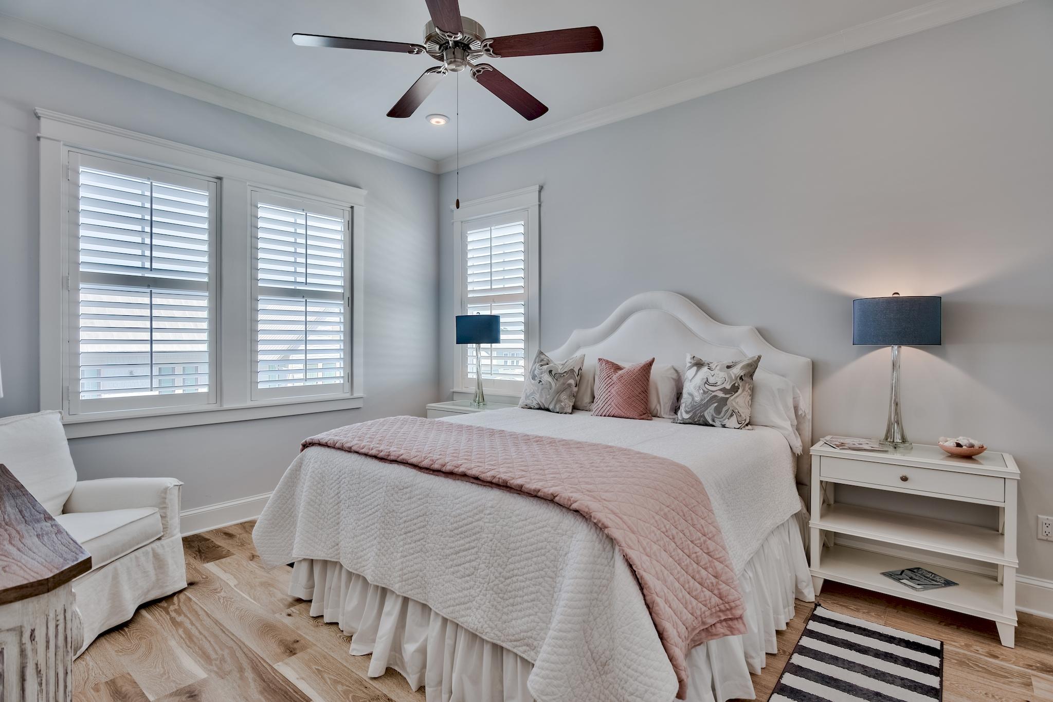 114 Clipper Street Inlet Beach, FL 32461 - Photo 25 of 64 a bedroom with a bed and a chandelier